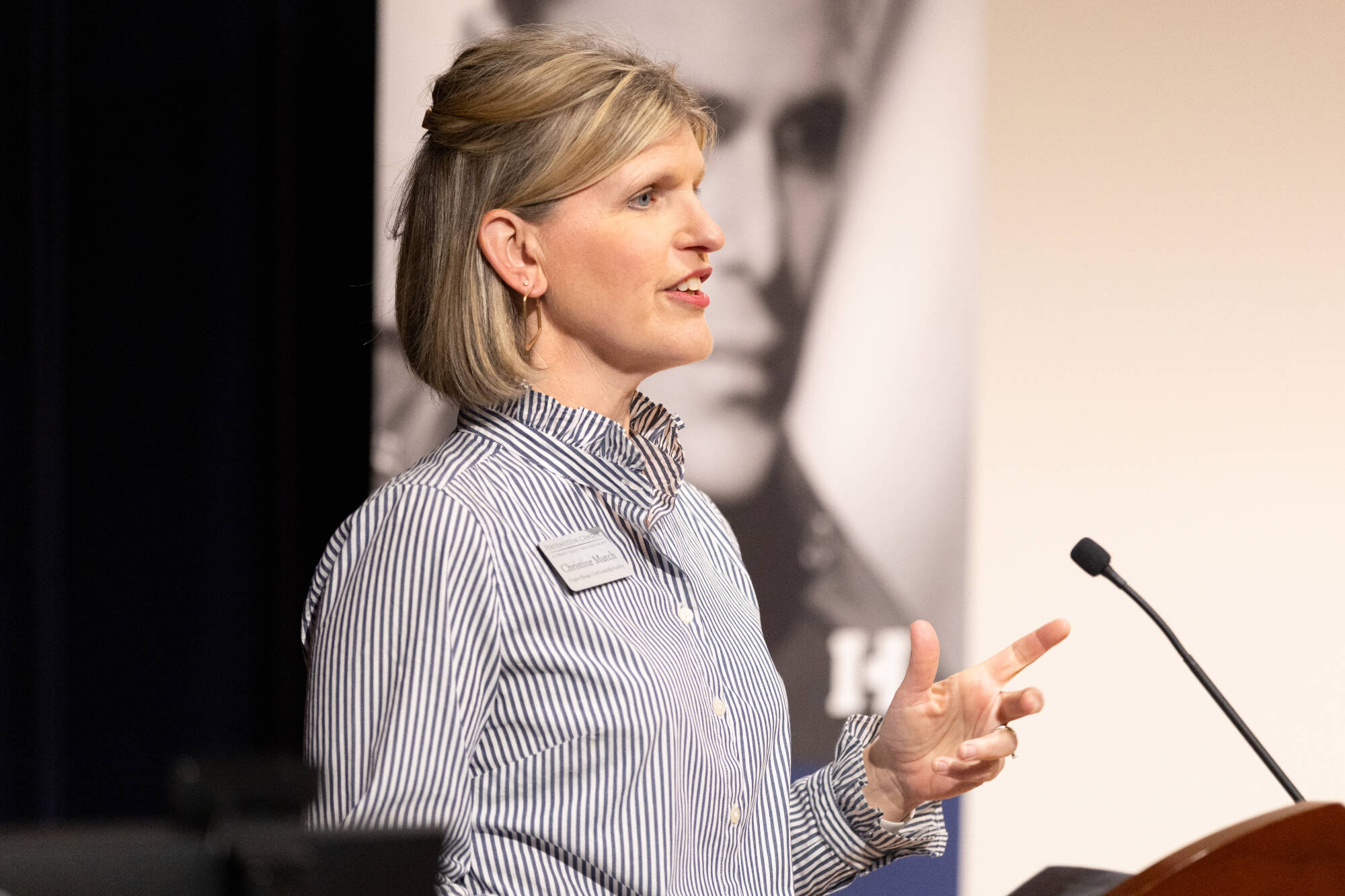 Christine Mutch speaks from stage